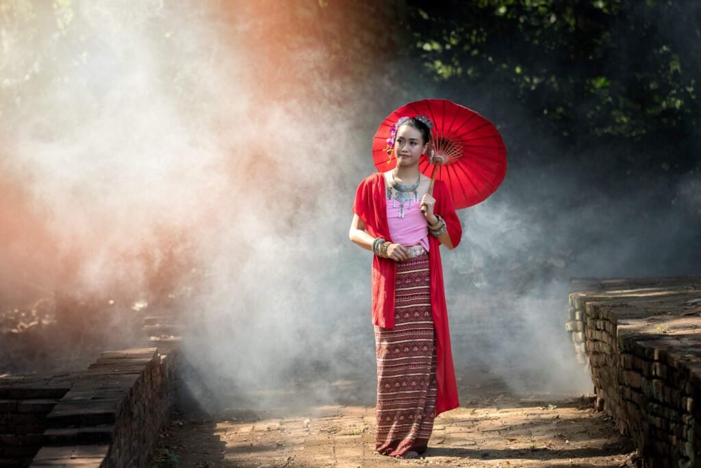 A bride and groom posing in front of a rustic floral arch, showcasing the high-quality wedding photography and professional wedding photography services available for outdoor ceremonies